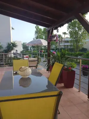 a table with a vase sitting on top of it at Cozy Home (close to the beach) in Agia Marina Nea Kydonias