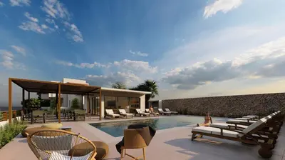 a villa with a swimming pool and lounge chairs at Kera Studios in Kalyves