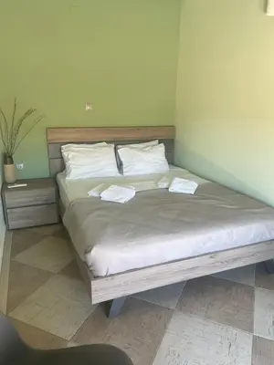 a bedroom with a bed with two towels on it at Ledakis House with Jacuzzi in Frangokastello