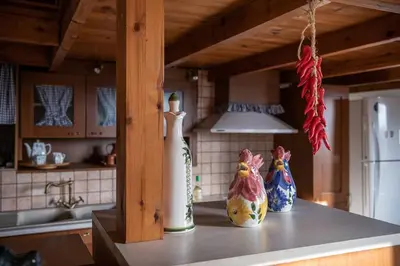 three vases sitting on a counter in a kitchen at Villa Kritiko Archontiko in Koprána