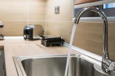 a kitchen sink with a water faucet at Cataleya Villa Chania in Daratso