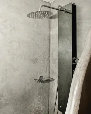 a shower with a glass door in a bathroom at Sclopa The Laography Project in Kolymvari