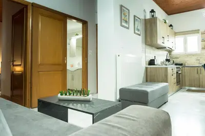 a living room with a couch and a table at Chrysa House Kissamos in Kissamos