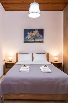 a bedroom with a bed with two towels on it at Chrysa House Kissamos in Kissamos