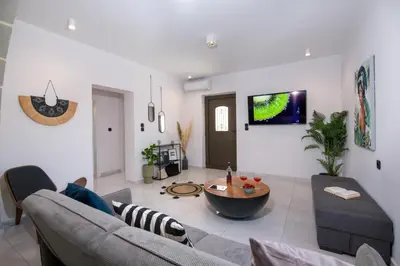 a living room with a couch and a table at Anastasia & Maria Luxury Residence in Kissamos