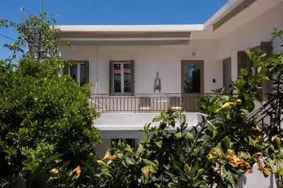a house with trees in front of it at MV Living - Residence in Chania Town