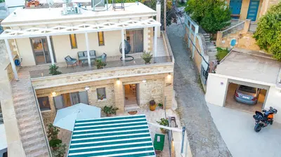 an overhead view of a house with a blue and white awning at Petros Luxury Traditional House - Villa in Kissamos