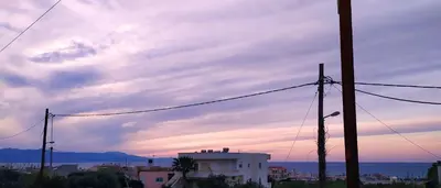 a view of a city with a cloudy sky at GioDriana cozy studio in Agia Marina Nea Kydonias