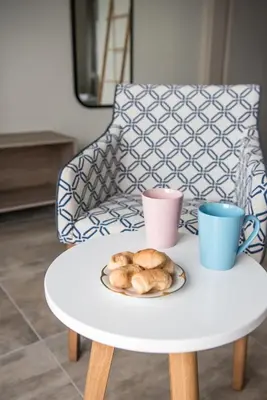 a table with a plate of croissants and two cups at Dinas's Cottage Ideal Base for Balos and Elafonisi in Kaloudhianá