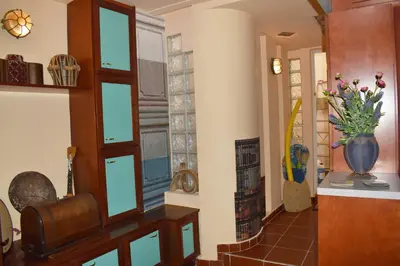 a hallway with glass windows and a vase of flowers at Loft Art Gallery, Chania, Crete in Chania Town