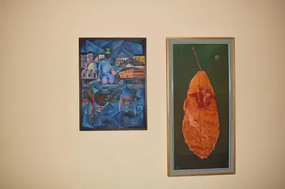 two pictures on a wall with a leaf on it at Loft Art Gallery, Chania, Crete in Chania Town