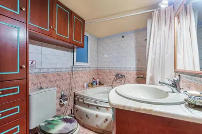 a bathroom with a sink and a tub and a toilet at Loft Art Gallery, Chania, Crete in Chania Town