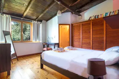 a bedroom with a large white bed and a window at Villa Palma in Maleme