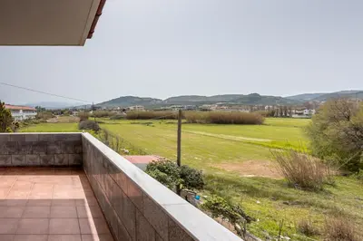a balcony with a view of a field at Agiazi Beachfront Apartment in Chania Town
