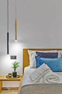 a bedroom with a bed with blue and white at Arch 4 Luxury Living in Chania Town