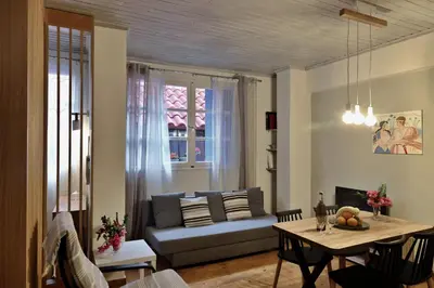 a living room with a couch and a table at Helianthi in Chania Town