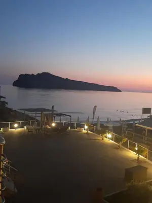 a view of a beach at night with lights at Comfy Beachfront Litinas Casa with SeaView in Chania Town