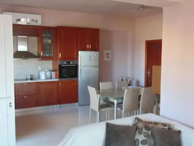 a kitchen and dining room with a table and chairs at Comfy Beachfront Litinas Casa with SeaView in Chania Town