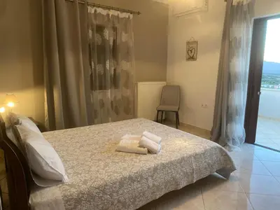 a bedroom with a bed with two towels on it at 