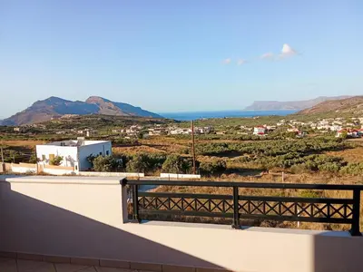 a view of the ocean from the balcony of a house at 