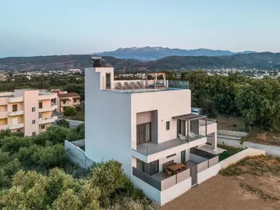 a house on a hill with a view at Soleado Villa Chania rooftop heated pool in Chania Town