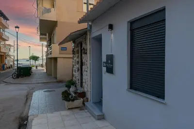 a building with a garage door on a street at Casa Del Mare Luxury Guest House in Chania Town