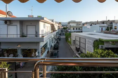 a view from a balcony of a street with buildings at Calliope Rooms 1 in Kissamos