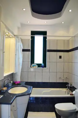 a bathroom with a sink and a tub and a toilet at Belle Verte Villa Maleme in Maleme