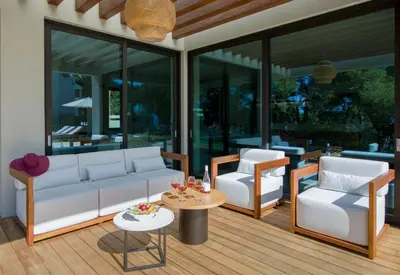 a living room with a couch and two chairs and a table at Villa Night Flower in Chania Town
