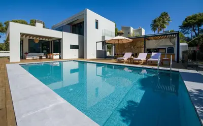 a swimming pool in front of a house at Villa Night Flower in Chania Town
