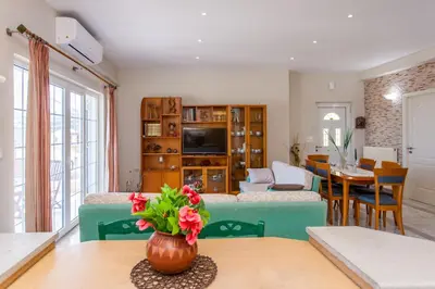 a living room with a couch and a table at Aura Estate in Chania Town