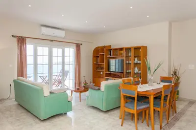 a living room with a table and chairs at Aura Estate in Chania Town