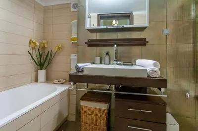a bathroom with a sink and a bath tub at Downtown apartment in Chania in Chania Town