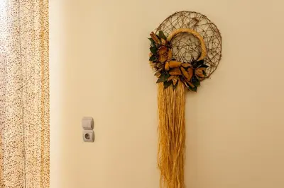 a wreath hanging on a wall with a wand at Downtown apartment in Chania in Chania Town