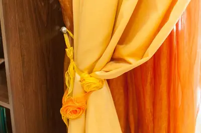 an orange curtain is hanging on a door at Downtown apartment in Chania in Chania Town