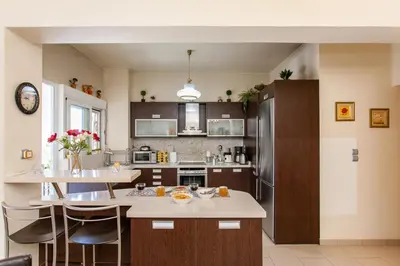 a kitchen with a island in the middle at Downtown apartment in Chania in Chania Town