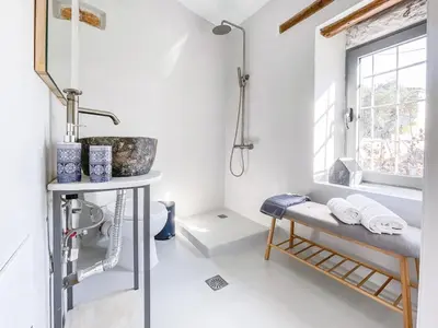 a bathroom with a shower and a sink at Armenous Green Dia's Mansion in Arménoi