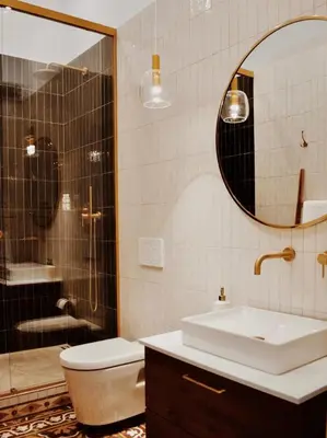 a bathroom with a sink and a toilet and a shower at Kale Kapi City Living in Chania Town
