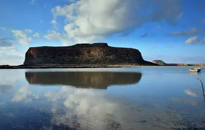 a small island in the middle of a body of water at Mouri Village in Aïkiryiánnis
