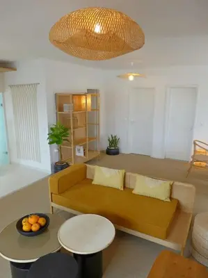 a living room with a couch and a table at FOS - casa casa group in Chania Town