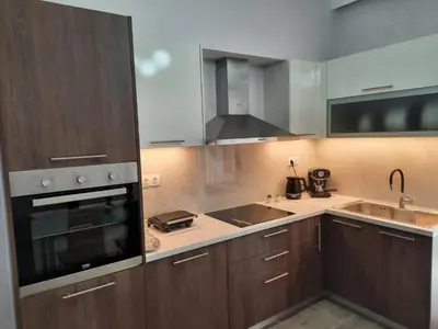 a kitchen with a sink and a stove top oven at SummerSense Apartment in Chania Town