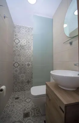 a bathroom with a white sink and a toilet at Pamelas House with Jacuzzi in Kissamos