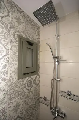 a bathroom with a shower and a mirror at Pamelas House with Jacuzzi in Kissamos