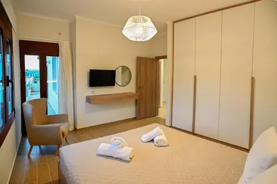 a hotel room with two towels on a bed at Ianthe Apartment in Kissamos