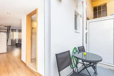 a small table with two chairs in a room at Neva's Apartment's in Center Chania 1 2 in Chania Town