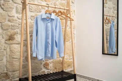 a blue shirt is hanging on a rack at Michalis NCHouse 33 in Chania Town