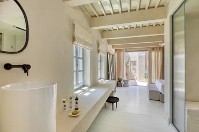 a bathroom with a sink and a mirror at AZADE Chania in Chania Town
