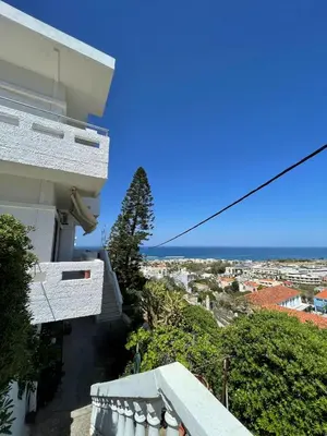 a view from the balcony of a building with the ocean at Aeolos Apartments Kolymbari in Kolymvari