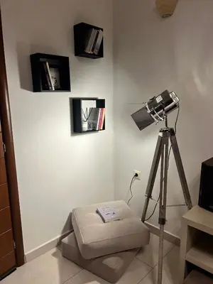 a room with a lamp and a camera on a wall at Zoi’s Apartment in Chania Town