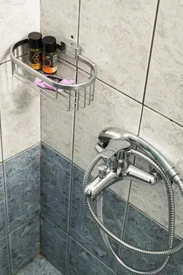 a shower with a hose and two bottles of honey at ''Meraviglia casa'' Irida apartment in Chania Town